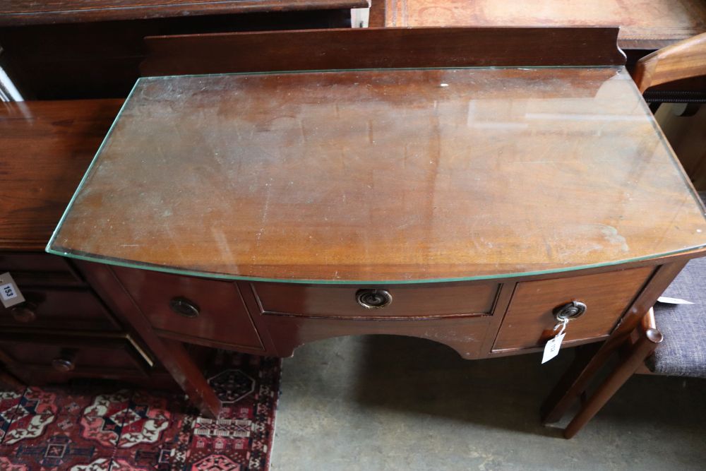 A Regency style mahogany bow-fronted dressing table, width 94cm depth 48cm height 74cm